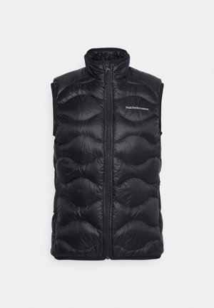 Black puffer vest with a high collar, zip closure, and quilted design featuring scalloped pattern. Logo placed on the upper left side.