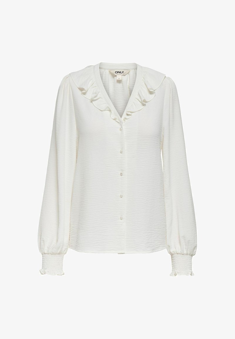 Blouse blanche à manches longues avec col à volants, fermeture boutonnée devant, tissu texturé et poignets élastiques à volants.