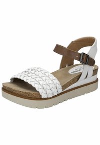 White braided strap sandal with a brown ankle strap, cork footbed, and white rubber sole featuring textured detailing.