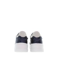 Sport shoes with a glittery navy upper, white sole, and perforated gray accents at the heel. Rounded shape with a textured surface.