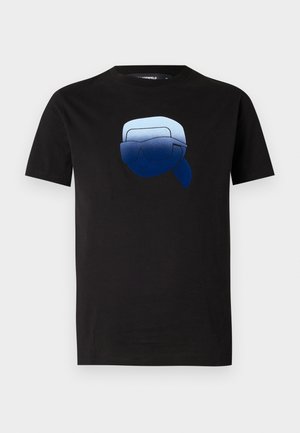 Black cotton t-shirt featuring a graphic of a blue character with sunglasses. Short sleeves and a crew neckline.