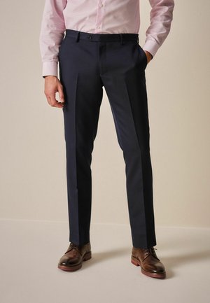 Marineblå skræddersyede bukser med en glat tekstur, featuring en flad front, to sidelommer og et slim fit design. Velegnet til formelle anledninger.