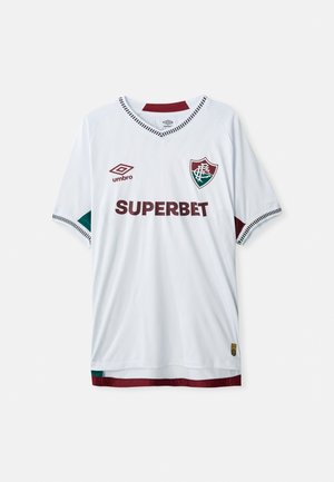 Biała koszulka piłkarska z bordowymi akcentami. Fason z dekoltem w serek, krótkie rękawy, z nadrukiem "SUPERBET" w kolorze bordowym. Posiada emblemat na lewej piersi.