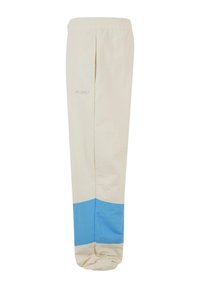 Pantaloni atletici bej cu un panou inferior albastru, talie elastică și un logo subtil pe lateral. Realizați dintr-un material ușor.