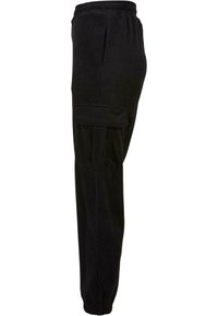 Pantalon cargo en velours côtelé noir avec taille élastique, poches latérales, poche à rabat sur la cuisse et ourlets élastiques aux chevilles.