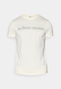 Cremefarbenes Baumwoll-T-Shirt mit kurzen Ärmeln, das in einer runden Schriftart den auffälligen schwarzen Text "BJÖRN BORG" auf der Brust trägt.
