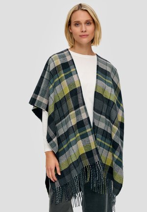 Châle à carreaux dans des tons de vert foncé, gris, noir et moutarde, avec des bords frangés et un design loose et ouvert. Matériel textile doux.