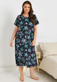 Svart blommig nattlinne med korta ärmar, prytt med färgglada fjärilar och blad. Tillverkat av mjukt tyg, knälång design.