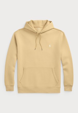 Kapuutiga särk heledas beežis, puuvilla segu kangast. Omab känguru taskut, reguleeritavaid nööre ja väikest logo rinnal.