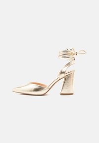 Ei valittu, gold-coloured