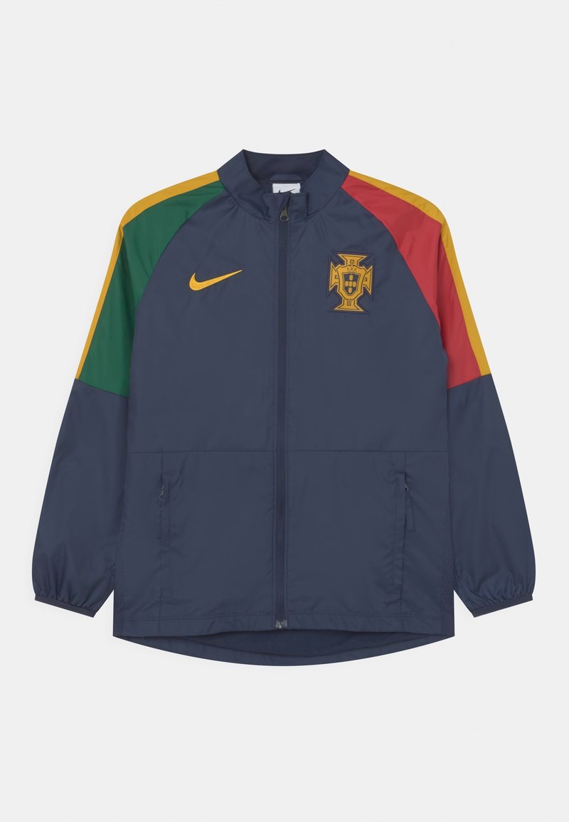 Navy windbreaker jacket with multi-colored sleeves (green, yellow, red), zip closure, and embroidered Portugal emblem on the chest.