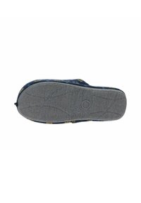 Suela de zapato con una parte inferior de goma texturizada en gris; parte superior de tela azul con patrones amarillos; bordes redondeados y un diseño minimalista.