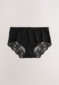 Svarta trosor med en slät tygframsida och en spetsbaksida med blommönster, dekorerade med vågiga kanter och en liten rosettdetalj.