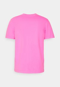Short-sleeve t-shirt in bright pink cotton, featuring a classic crew neck and a smooth texture with no visible design elements.