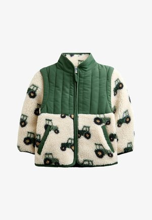 Kinderjacke mit grünen, gesteppte Schultern und cremefarbenem Sherpa-Fleece-Körper und Ärmeln mit Traktormuster, Fronttaschen und Stehkragen.