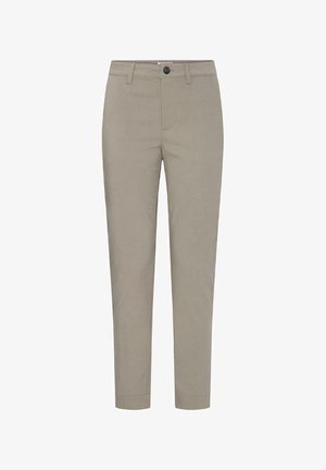 Beżowe spodnie o dopasowanym kroju, z szlufkami na pasek, zapięciem na guzik i suwak, przednimi kieszeniami i nogawkami o długości do kostek.