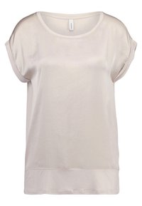 Top corto beige claro de manga corta, hecho de una tela suave y lisa, con un corte relajado y un escote redondeado con un dobladillo ligeramente curvado.