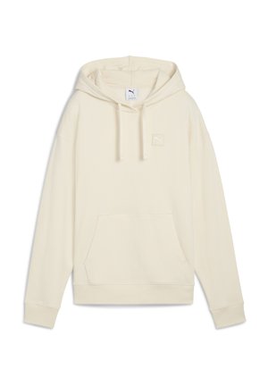 Cream hooded sweatshirt made of soft fabric. Features a kangaroo pocket and a small logo patch on the chest. Relaxed fit and ribbed cuffs.