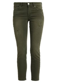 Jeans ajustados de color verde oliva hechos de denim, con una cintura alta, cinco bolsillos y detalles desgastados en la parte frontal.