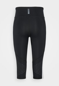 Leggings sportivi neri con vita alta, texture liscia e dettagli perforati. Design semplice con particolari riflettenti sul retro.