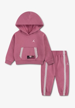 Pink toddler hoodie and joggers set with white lace trim, kangaroo pocket, white Jordan logo, and elastic waist and cuffs.