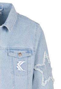 Light blue denim jacket with a classic collar, distressed star appliqué on the sleeve, and embroidered logo on the chest pocket.