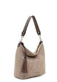 Beige fabric handbag with a slouchy design, featuring a brown leather strap and a decorative tassel with metal accents.