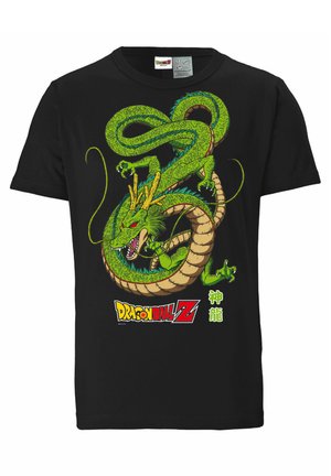 T-shirt en coton noir présentant un graphique de dragon vert vibrant avec des détails complexes, des yeux rouges et le logo "Dragon Ball Z" en jaune et blanc.