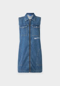 Denim bezpiedurkņu kleita ar pilnīgu priekšējo rāvējslēdzēju, divām krūšu kabatām un logo detaļām. Vidēja garuma, ar klasisku zilā krāsā un brīvu piegriezumu.