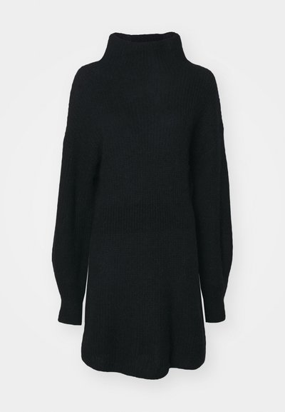 Μαύρο πλεκτό πουλόβερ με ψηλό λαιμό, μακριά μανίκια και χαλαρή εφαρμογή. Υφασμάτινη υφή με χαλαρή σιλουέτα και χωρίς ορατά σχέδια.