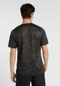 Black graphic t-shirt with a textured pattern, short sleeves, and a round neckline. Material appears lightweight and breathable.