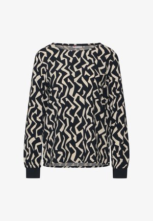 Camicia a maniche lunghe in nero e crema con un motivo astratto a zigzag. Presenta una vestibilità rilassata e polsini elasticizzati. Tessuto liscio e leggero.