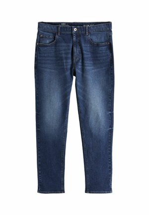 Jean en denim bleu ajusté avec une finition délavée, design à cinq poches et coutures contrastées. Le matériau est doux et texturé.