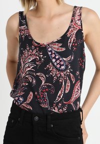 Black tank top with a paisley floral pattern in red and blue, featuring a scoop neck and loose fit, crafted from lightweight fabric.
