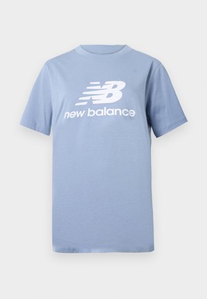 Light blue cotton t-shirt with short sleeves and a crew neck, featuring a large white New Balance logo on the front.