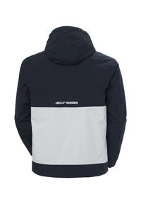 Herenjacket in marineblauw met een witte onderpaneel. Voorzien van een capuchon en het "HELly HANSEN" logo op de achterkant. Glad, waterdicht materiaal.