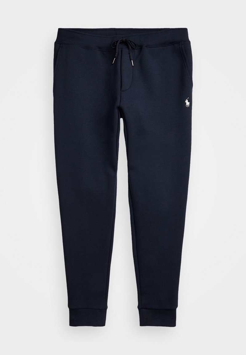 Dunkelblaue Jogginghose aus weichem Stoff, mit elastischem Bund und Kordelzug, schmal zulaufenden Beinen und einem kleinen Emblem auf der oberen linken Seite.