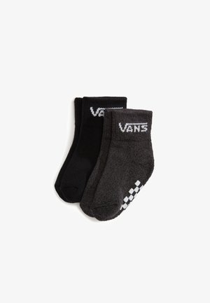 Dwie pary skarpetek do kostek, jedne czarne, drugie ciemnoszare z białym logo Vans i wzorem w kratkę na palcach.