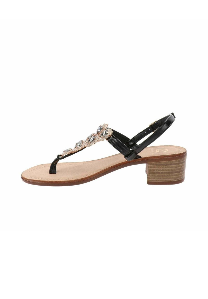 Sandal a sfondo nero con tacco basso e impilato, caratterizzato da una design a T impreziosita da strass trasparenti e una soletta beige.