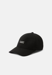 Crna vunena bejzbol kapa s okruglom krovu, zakrivljenim vizetom i vezenim "GANT" logom na prednjoj strani. Glatka tekstura, bez dodatnih akcenta.