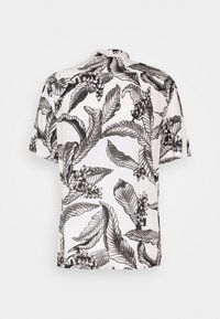 Camicia a maniche corte con un motivo floreale in bianco e nero, con foglie e fiori dettagliati su un tessuto leggero.