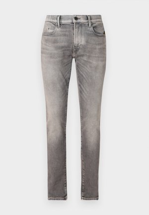 Szare dżinsy w slim fit, o przetarciu, pięć kieszeni, z przodem zapinanym na guzik oraz subtelnymi detalami przeszycia.
