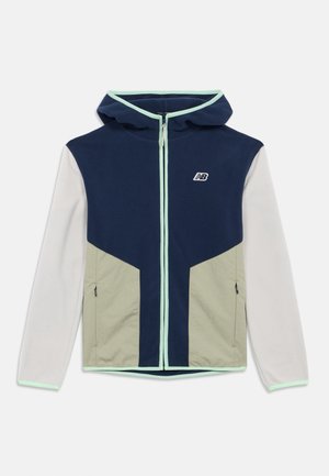 Veste à capuche zippée pour homme avec des blocs de couleurs bleu marine, beige et gris clair, poches zippées, et des finitions vert menthe sur la capuche et les poignets.