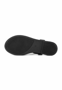 Suola di scarpa in gomma nera con texture rigata per una maggiore aderenza. Presenta un design piatto senza hardware o decorazioni visibili.