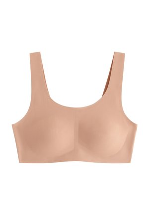Nude trådløs BH med brede stropper, jevn tekstur og avrundet fasong; designet for komfort med sømløs formgiving. Ingen utsmykninger.
