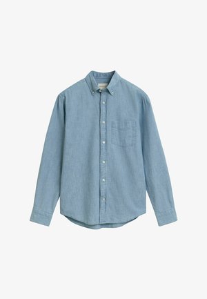 Lyseblå langærmet skjorte lavet af chambray stof. Har en krave med knaplukning, frontlomme og knaplukninger foran.