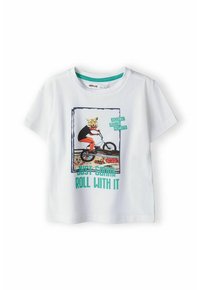 T-shirt en coton blanc à manches courtes avec un graphique coloré d'un tigre sur un vélo, le texte indique "Je vais juste suivre le mouvement."