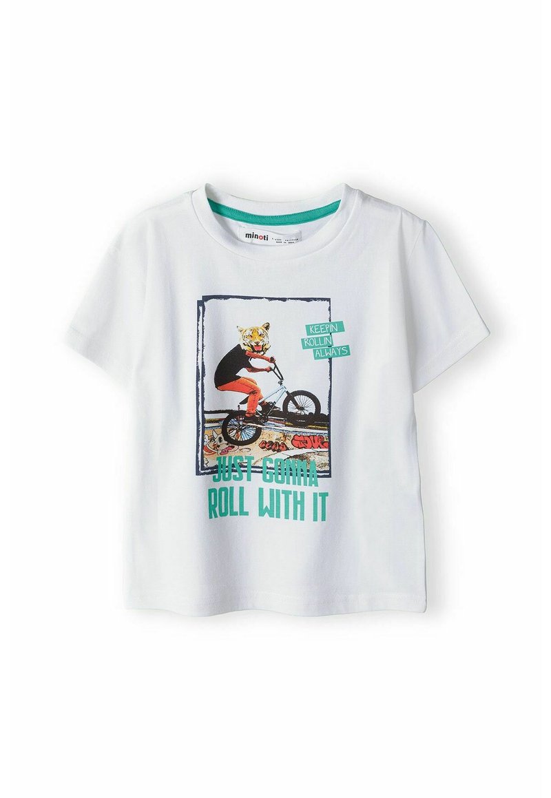 T-shirt en coton blanc à manches courtes avec un graphique coloré d'un tigre sur un vélo, le texte indique "Je vais juste suivre le mouvement."