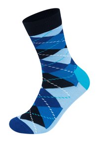 Farverige blå sokker med et geometrisk mønster i varierende nuancer af blå, sort og hvid. Fremstillet af strikket stof med en ribbet kant.