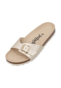 Beige slide sandal med en bred rem, justerbar metallspänne, korkmellansula och strukturerad vit gummisula.